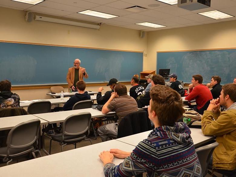 Dr. Bill White teaching a communications class